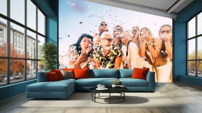 Confetti party celebration for happy cheerful crazy caucasian people women blowing out enjoying the event outdoor - carnival or birthday concept for cheerful pretty ladies Wall mural