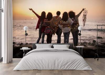 Dreaming image with group of females friends hug each other all together looking the sunset for friendship and love concept - Forever friends and dream lifestyle concept - people enjoying and feeling  Wall mural