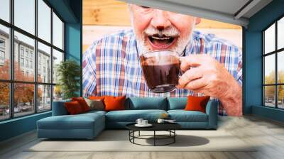 Funny happy senior people caucasian old man drinking hot chocolate and have it on nose and beard - laugh and have fun - concept of seniority and cheerful elderly retired lifestyle Wall mural