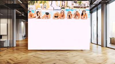 Group of cheerful happy people lay down at the pool on a white floor - friendship and young women on vacation concept - friends having fun together during summer holiday vacation Wall mural