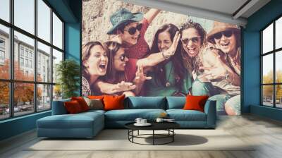 group of crazy nice beautiful caucasian girls outdoor under the summer sun doing a party all together. people having fun iall together oncept lifestyle. shout and laugh full of joyful women Wall mural