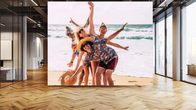 Group of happy caucasian young people boys and girls have fun and enjoy the beach in summer holiday vacation together laughing - cheerful men and women outdoor leisure activity - ocean background Wall mural