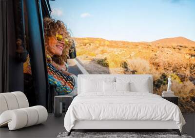 happy beautiful free modern caucasian woman travel on the road with a car - transport and people enj Wall mural