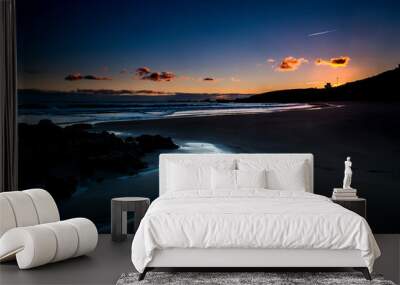 Quiet and relaxed scenic beach place during dusk sunset with coloured sky in background - sea shore outdoor vacation concept - freedom and lifestyle night picture with nobody there Wall mural