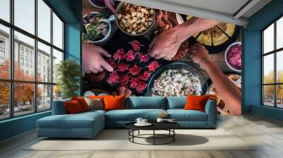 Vertical top view of friends eating together  on a wooden table full of food - friendship and celenration people - concept of friendship with adult men and women at home or restaurant Wall mural