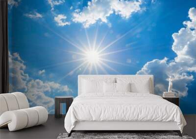 View of the sun in the blue sky with clouds. Wall mural