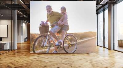 wanderlust travel  and joy for mature couple. happiness and joyful for caucasian man and woman people with alternative lifestyle. having fun in outdoor leisure activity Wall mural