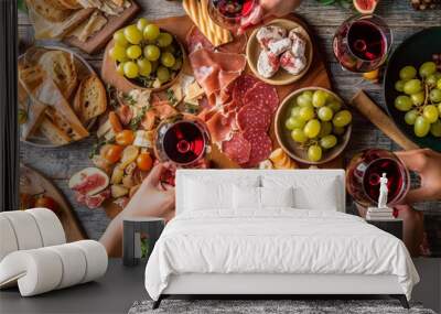 Above view on table with food and people with glasses of wine Wall mural