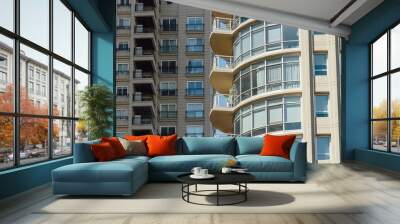 Blue windows and balconies of one apartment building in front of another Wall mural