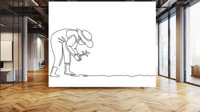 Continuous one line drawing young female farmer planting plant shoots in the ground. Start the planting period. Success farming minimalist concept. Single line draw design vector graphic illustration. Wall mural