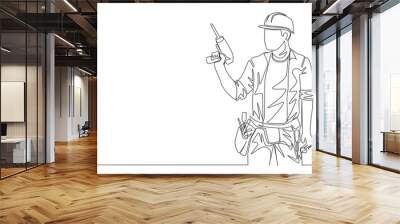 One single line drawing of young handyman wearing uniform while holding drill machine. Repairman construction maintenance service concept. Continuous line draw design illustration Wall mural