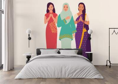 Three Women Dressed In Beautiful Traditional Clothes Greeting. Wall mural