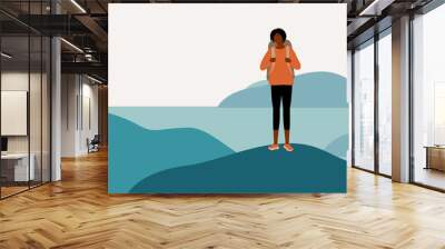 Young Black Woman Hiker With Backpack Hiking Alone And Standing On Top The Mountain Peak. Travelling Solo. Wall mural