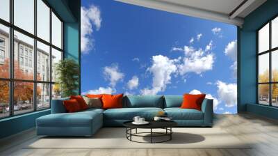 Nice weather. Beautiful clouds on blue sky. Wall mural