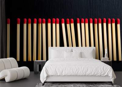 Matchsticks, partially burned, arranged against a dark background (20) Wall mural