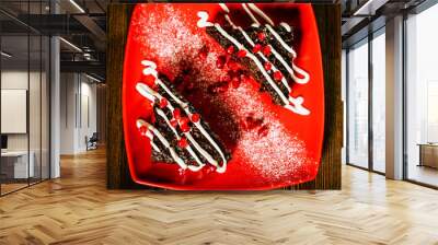 christmas chocolate cake dessert with pomegranate on wooden tabl Wall mural