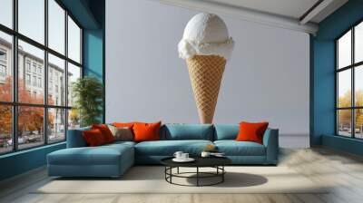 103.A waffle ice cream cone holding a single scoop of creamy ice cream, set against a white backdrop. The clean lines and textures of the cone and ice cream make it stand out in sharp detail. Wall mural