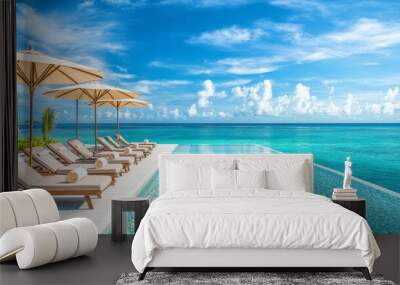 149. Detailed image of a stylish poolside lounge area, with cozy beds and umbrellas, set against the backdrop of a tranquil ocean and blue sky Wall mural