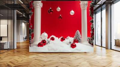 2408 48.A stylish holiday display featuring white columns surrounded by festive Christmas ornaments and snow. The bright red backdrop creates a vibrant contrast, ideal for showcasing winter products, Wall mural