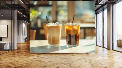 59. Iced americano and iced coffee milk glasses on a bright white wooden table, emphasizing the cold and refreshing nature of the beverages in a stylish coffee shop Wall mural