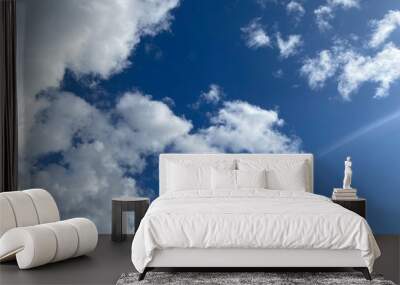 White clouds on a blue sky. Wall mural