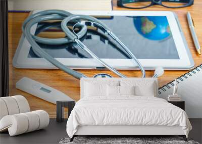 Medical stethoscope for doctor checkup on tablet computer Wall mural