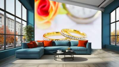 Two golden wedding rings on white Wall mural