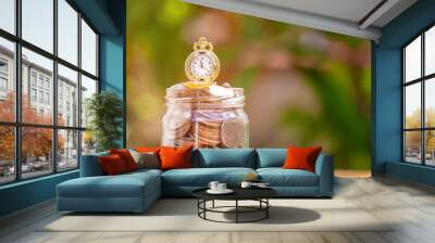 glass jar with retro clock for time to money saving for retirement concept Wall mural