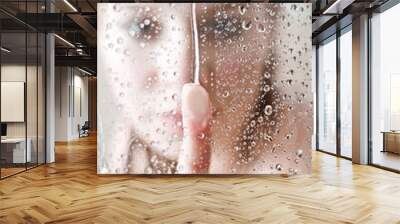 showering woman shot from behind glass Wall mural