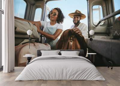 Black couple, travel and packing for road trip, journey or adventure with bags together. Happy African American man and woman pack for traveling in summer vacation, holiday or break in Mexico Wall mural