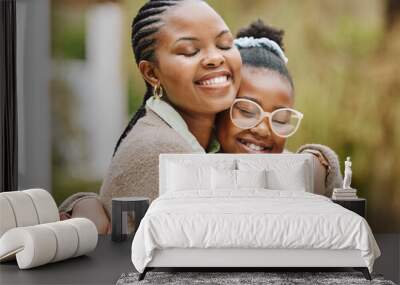 A mothers love. Cropped shot of an attractive young woman and her daughter embracing outdoors. Wall mural