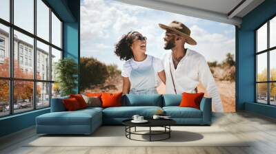 Couple, travel and happy outdoor road trip of black people enjoying nature with love. Happiness of girlfriend and boyfriend smile together laughing with a hug on a summer dessert holiday in the sun Wall mural