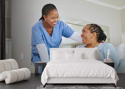 Everythings changing, but Im here for it. Shot of a nurse speaking to her female patient. Wall mural