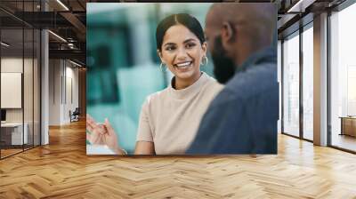 This is a great pitch. Shot of a businesswoman having a meeting with her colleague while using a digital tablet. Wall mural