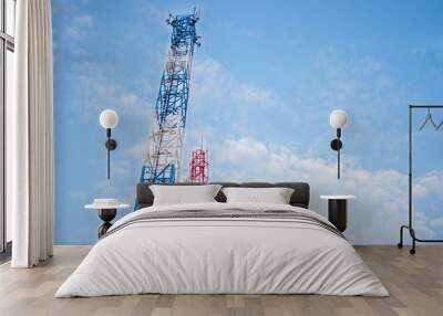 two antenna for mobile phone communication in clear blue sky. Wall mural