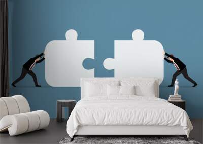 businessmen pushing two jigsaw pieces together Wall mural