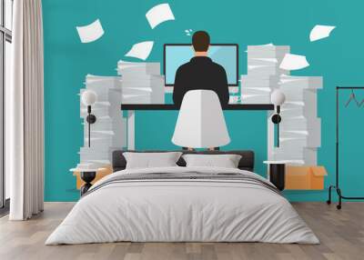 Busy businessman working on computer with pile of papers Wall mural