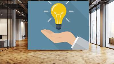 Hand holding lightbulb idea Wall mural