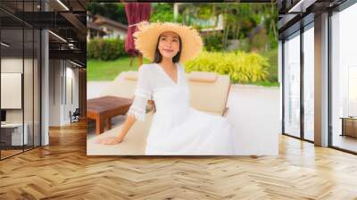 Portrait beautiful asian woman wear hat with smile happy leisure on the beach and sea in holiday vacation Wall mural