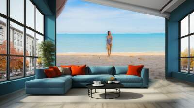 Portrait beautiful young asian woman happy smile relax on the tropical beach sea ocean for leisure travel Wall mural