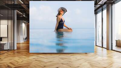 Portrait beautiful young asian woman relax around swimming pool in hotel resort Wall mural