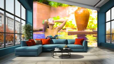 Portrait beautiful young asian woman relax smile enjoy leisure around swimming pool Wall mural