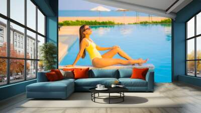 Portrait beautiful young asian woman relax smile enjoy leisure around swimming pool Wall mural