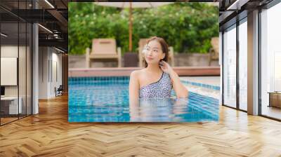 Portrait beautiful young asian woman relax smile leisure around outdoor swimming pool Wall mural