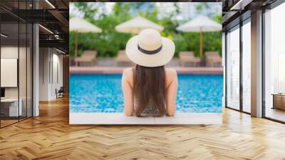 Portrait beautiful young asian woman relax smile leisure around outdoor swimming pool Wall mural