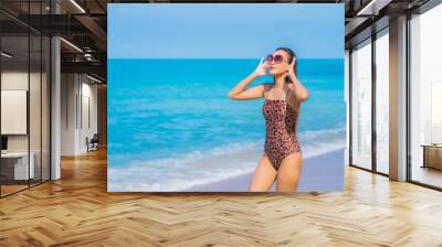 Portrait beautiful young asian woman relax smile leisure around sea beach ocean Wall mural