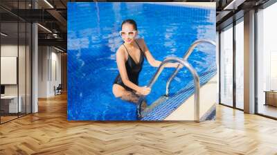 Portrait beautiful young asian woman smile relax leisure around outdoor swimming pool Wall mural