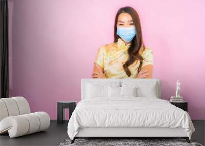 Portrait beautiful young asian woman wear mask for protect from covid19 Wall mural