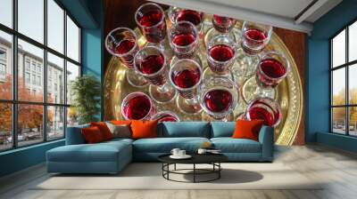 Setting red wine glasses on a gold tray in Bible study Wall mural