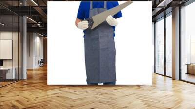 asian worker man in blue shirt with apron and protective gloves hand holding saw isolated on white Wall mural